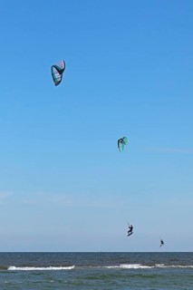 Two kitesurfers jumping, Baltic Sea, Falshöft, Pommerby, Schleswig-Holstein, Germany