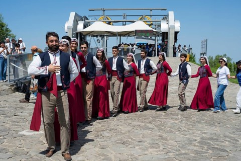 Group in traditional costumes at a festive gathering, folklore, Tatev, Tatev, Syunik province,