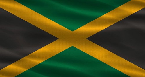 Jamaica flag with fabric texture. Realistic flag of Jamaica waving
