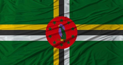 Dominican flag waving. Flag of Dominica with cloth texture