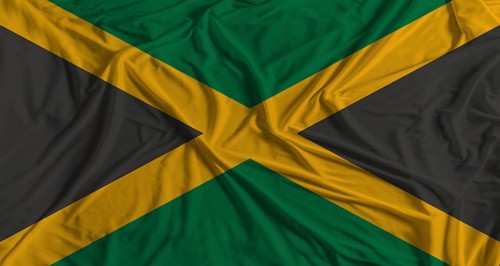 Jamaican flag with fabric texture background. National flag of Jamaica