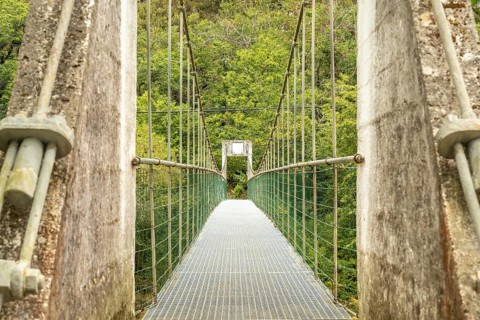 Metal suspension bridge crossing the sella river, connecting the dobra river route with the olla de