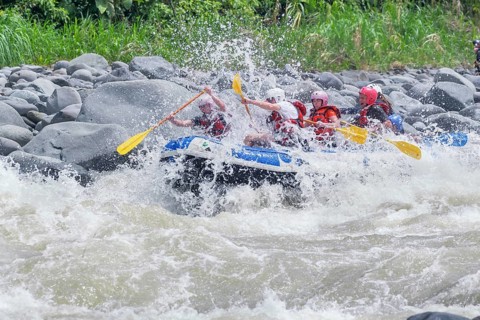 A group of people white water rafting, Costa Rica, Central America