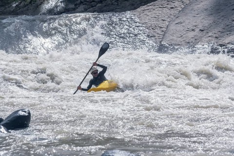 Young woman kayaking in river, Costa Rica, Central America