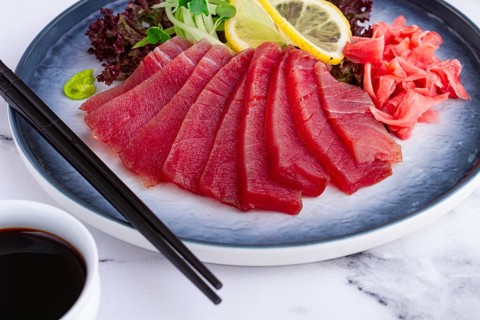 Tuna sashimi, with side dish, on a marble table, homemade, no people