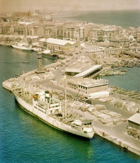 View from cable car of cargo ship 'Fylgia' in port, view to Barceloneta area, city of Barcelona,