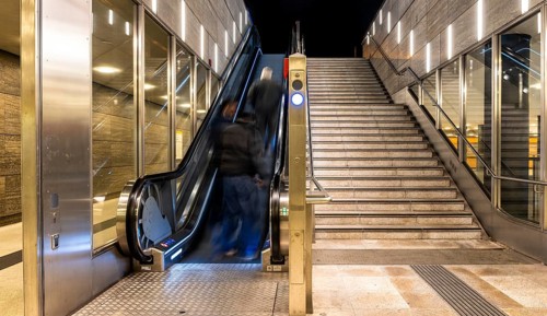 Night photo, long exposure with motion blur, modern underground entrance at Unter den Linden