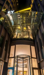 Night photo, main entrance from the frog's perspective, office complex of Ernst & Young Law GmbH