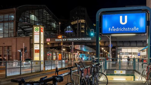 Night photo, long exposure at Friedrichstraße S-Bahn and metro station, in the centre runs the tram