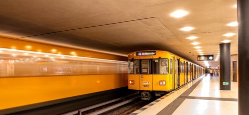 Dynamic scene of a Berlin underground in typical yellow colour, long exposure with blur effect,
