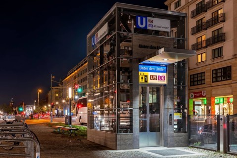 Night photo, long exposure with motion blur, modern lift at Unter den Linden underground station,