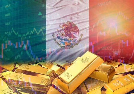Gold bars on Mexico flag in background. Gold bars stacked on Mexican flag. Concept of Mexico gold
