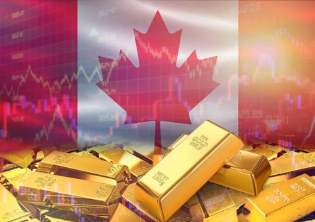 Gold bars on Canada flag in background. Gold bars stacked on Canadian flag. Concept of Canada gold