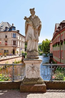 Ettlingen, Germany - August 13th 2025: Statue of Saint John of Nepomuk on Rathausbrücke bridge over