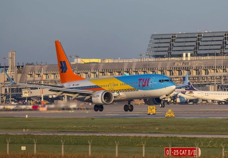 Flight operations at Stuttgart Airport with terminal. Aircraft on landing. Aircraft registration