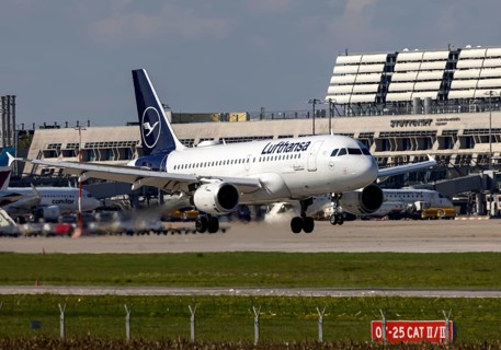 Flight operations at Stuttgart Airport with terminal. Aircraft on landing. Aircraft registration