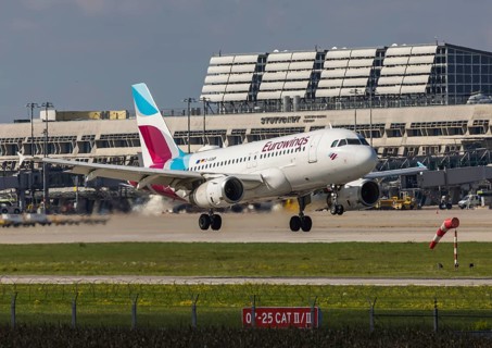 Flight operations at Stuttgart Airport with terminal. Aircraft on landing. Aircraft registration