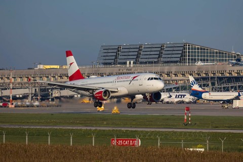 Flight operations at Stuttgart Airport with terminal. Aircraft landing. Aircraft registration: