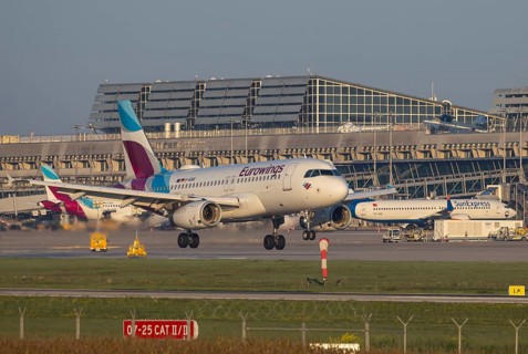 Flight operations at Stuttgart Airport with terminal. Aircraft on landing. Aircraft registration