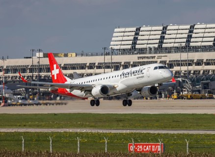 Flight operations at Stuttgart Airport with terminal. Aircraft on landing. Aircraft registration