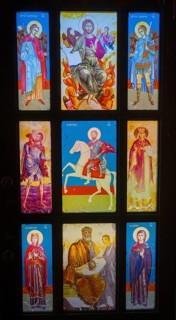 Stained glass window with detailed images of saints in bright colours, Dashtadem Fortress, Qagheni