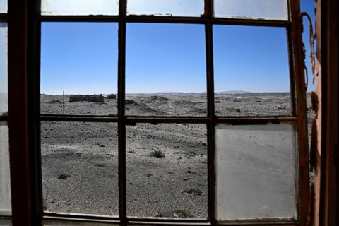 View from a dilapidated building into the desert, Pomona, restricted diamond area, near Lüderitz,