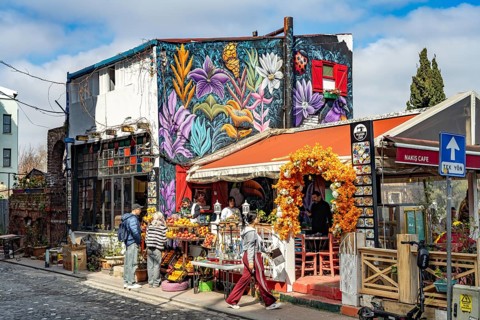Cafe with graffiti in the colourful Balat district, Istanbul, Turkey