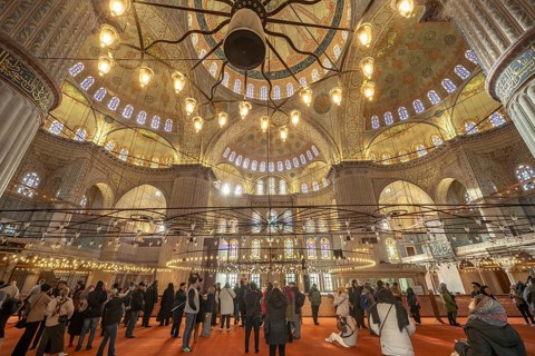 Visitors to the Blue Mosque or Sultan Ahmed Mosque in Istanbul, Turkey