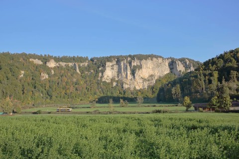 Railway line with train and view of rock formations, landscape, rock formations, rock cliffs,