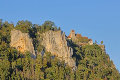 Werenwag Castle on the mountain with rock formations, cliffs, forest, landscape, light mood,