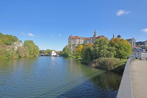 Hohenzollern Castle and Danube, bank with Panthelstein and autumn colours, landmark, castle bridge,