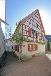 Half-timbered house with red shutters, Höllgasse, Wiesloch, Baden-Württemberg, Germany