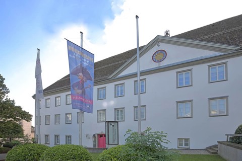 Old Castle and Hohenzollern State Museum built in 1705, flags, banners, Hechingen, Swabian Alb,