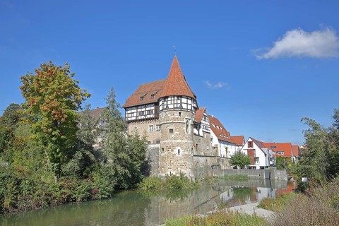 Zollern Castle built around 1255 with water tower on the Eybach stream, half-timbered house,
