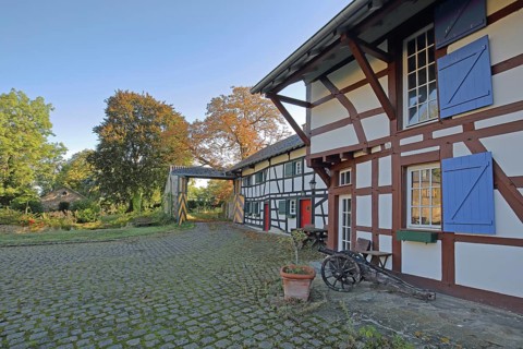 Half-timbered house with colourful shutters and entrance, built 14th century, inner courtyard,