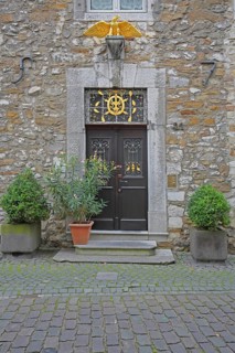 Front door with golden eagle figure to Kupferhof Schleicher, decoration, Burggasse, Rhineland,