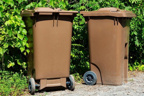 Brown plastic portable composting bins for depositing organic materials and leftover foods in,