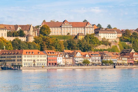 Historic buildings along the lakeshore, surrounded by hills, Meersburg, Lake Constance, Germany