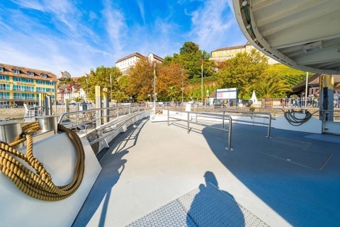 Open ship deck with a view of the shore landscape and autumn weather, Meersburg, Lake Constance,