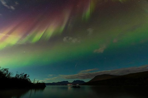 Magical northern lights and a shooting star over Abisko, Lapporten and Lake Torneträsk