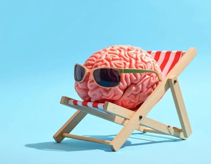 Brain relaxes on a sunbed under the summer sun, placed on a flat surface, symbol for mental health,