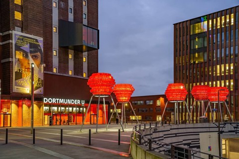 Illuminated sculptures of Dortmund roses in front of Dortmund's landmark U, Centre for Art and