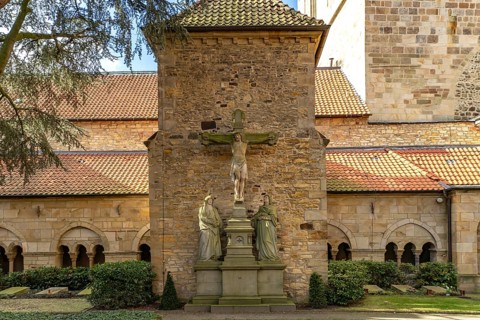 Inner courtyard with crucifix and cloister of St Peter's Cathedral in Osnabrück, Lower Saxony,