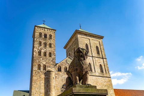 Lion poodle figure in front of St Peter's Cathedral in Osnabrück, Lower Saxony, Germany