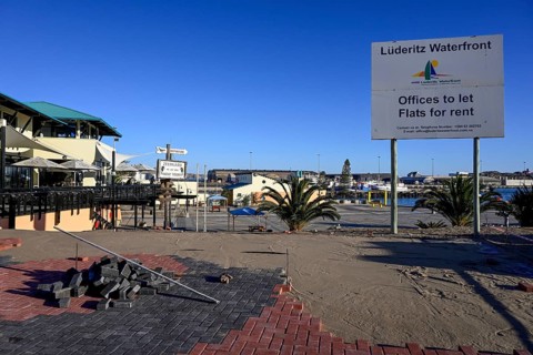 Sign at a building site on the waterfront, Robert Harbour, Lüderitz, Karas Region, Namibia
