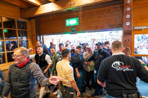 Crowd of people trying to get into the marquee, lively atmosphere, Cannstatter Wasen folk festival,