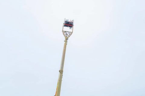 An attraction with people and a wide view of the sky, Cannstatter Wasen fair, Stuttgart, Germany