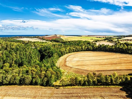 Farms and Fields over Ayton Castle from a drone, Ayton, Eyemouth, Scottish Borders, Scotland, UK