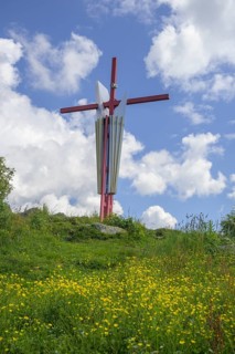 Colourful summit cross on the Mugel, Niklasdorf, Styria, Austria