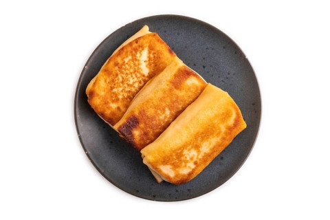 Fried crispy pancakes with meat and cheese isolated on white background. side view, copy space